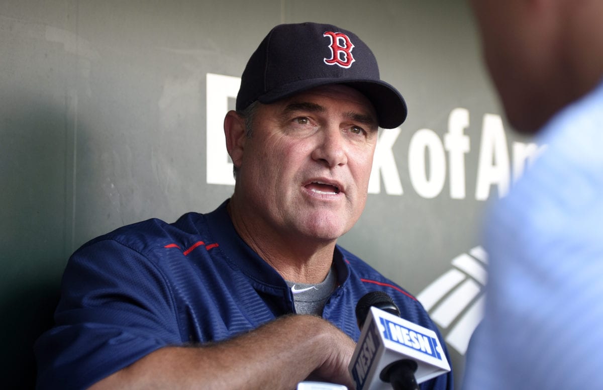 Boston Red Sox manager John Farrell talks to reporters prior to the start of a game.