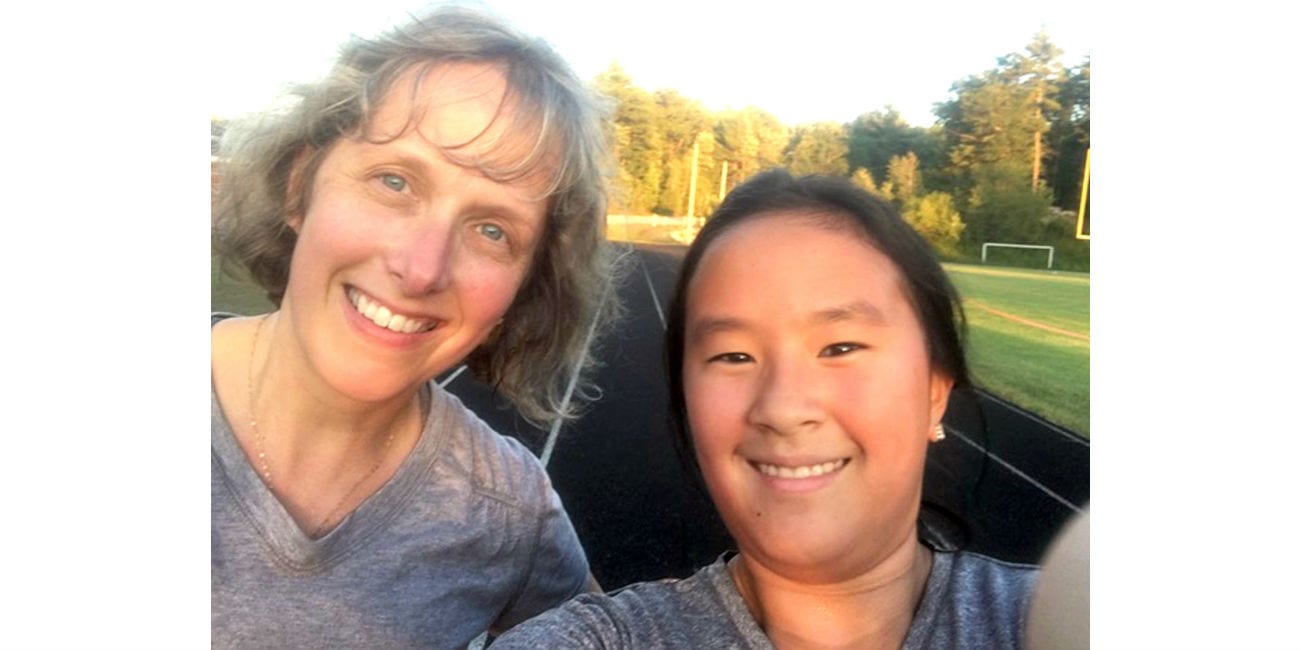 Carol Ann Neff, left, with her adopted daughter from China (one of four children) has fond memories of her Daily Evening Item paper route in her Holyoke Street neighborhood.