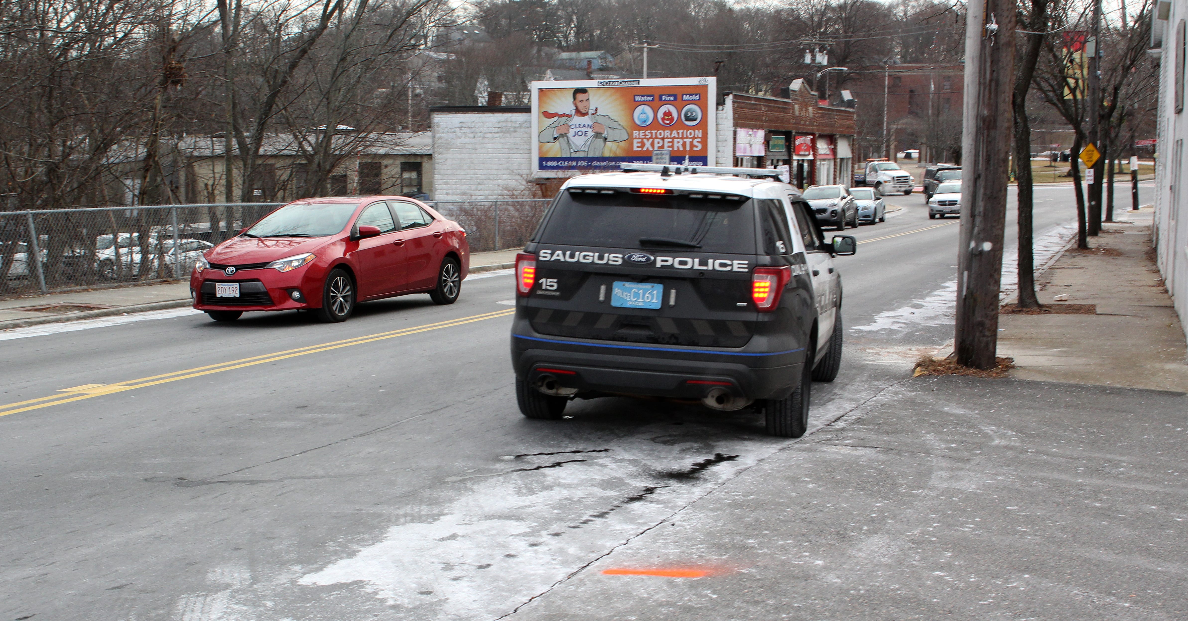 Saugus, Ma. 1-16-18. A Saugus police car leaves the scene of a pedestrian accident today.