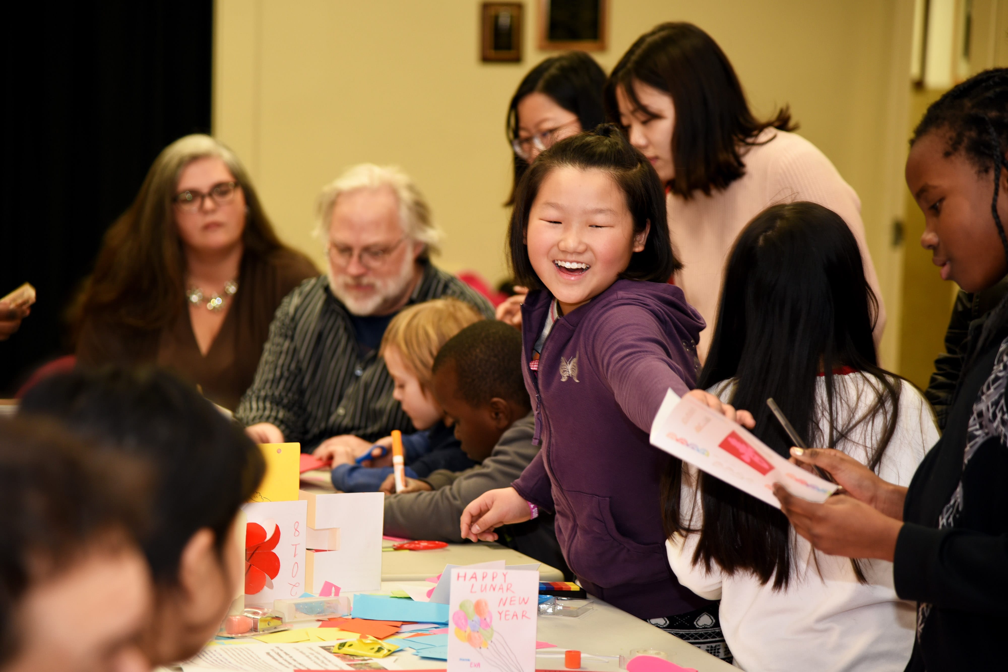 Catherine Xu having fun with friends during the February 15th Chinese New Year Celebration at the Medford Public Library.