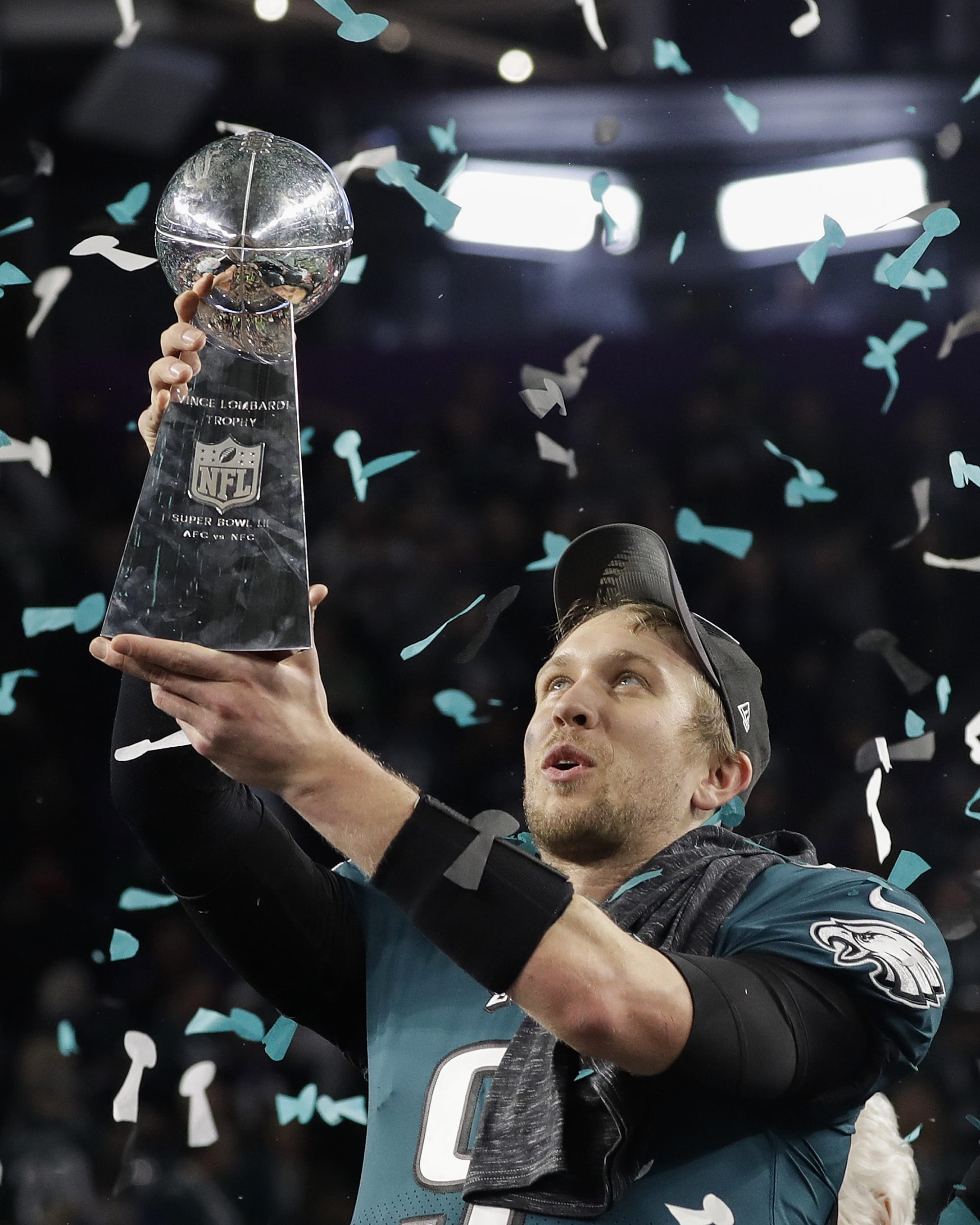 Philadelphia Eagles' Nick Foles holds up the Vince Lombardi Trophy after the NFL Super Bowl 52 football game against the New England Patriots, Sunday, Feb. 4, 2018, in Minneapolis. The Eagles won 41-33.