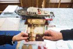 Maureen Quirk Ouellette and Frank Quirk III hold a photo of their father, Frank Quirk Jr., who died after rescuing a Coast Guard crew during the Blizzard of '78.