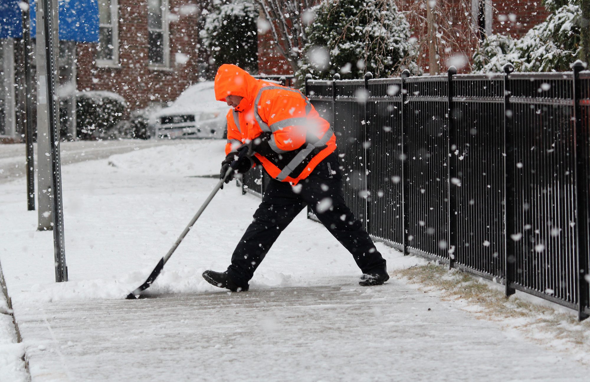 Lynn, Ma. 2-7-18. Tony DeLeon shovels the sidewalk on Silsbee Street.