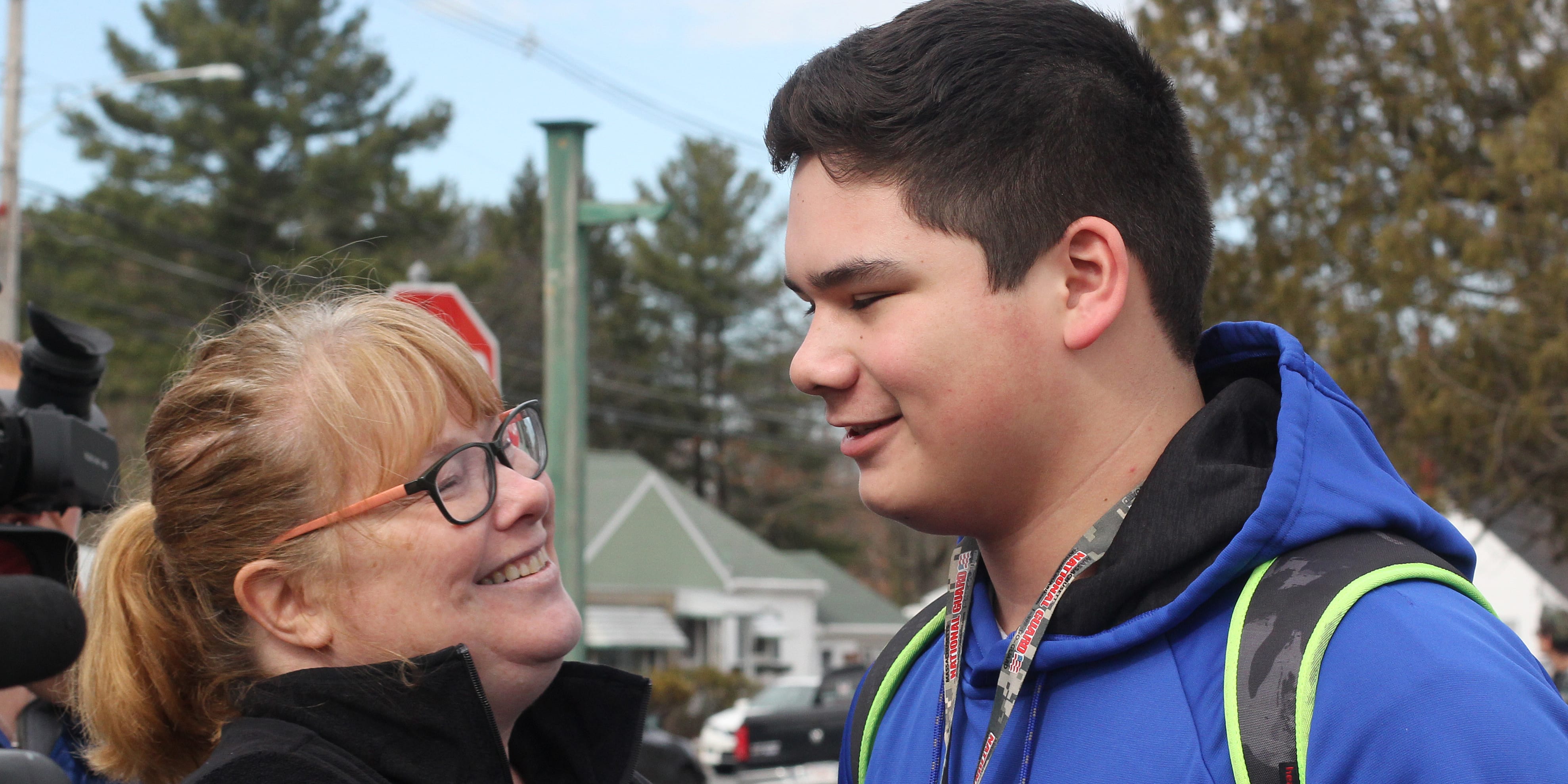 Tracy Siose and her son Christian reunite after the lockdown at Northeast Metropolitan Regional Vocational Technical High School.