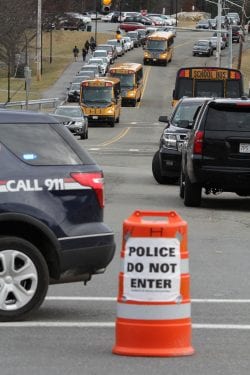 Wakefield, Ma. 2-26-18. School buses leaving Northeast Metropolitan Regional Vocational Technical High School with students after the school was dismissed after a lock down.