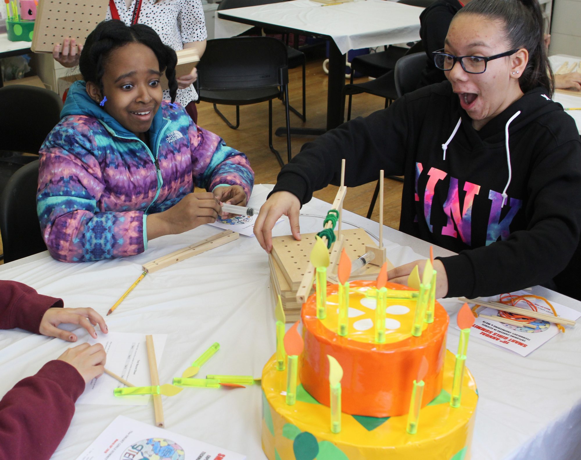 Lynn, Ma. 3-28-18. Myraim Meloncourt, left, and Janessa Lopez have success in the hydraulics workshop at the the 16th annual smart girls summit at Girl's Inc.