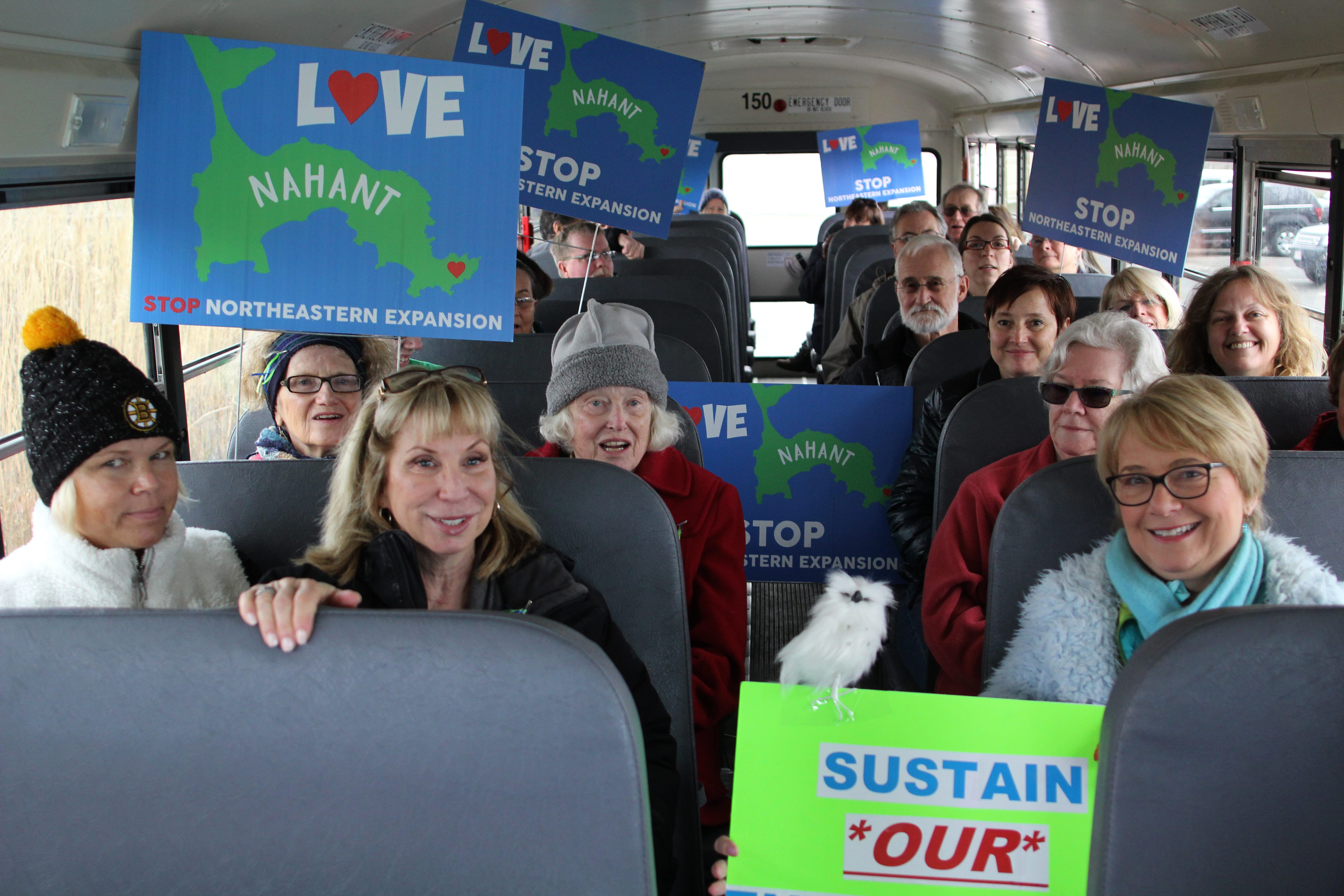 Nahant, Ma. 4-10-18. Nahant residents on board the bus that will take them into Northeastern in Boston where they will present the university with a signed petition to stop the expansion of Norheastern in Nahant.