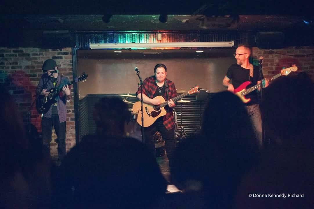 Jme Redd, center, performs with guitarist Peter Davis (left) and bassist Christopher Stone at O'Brien's in Lynn.