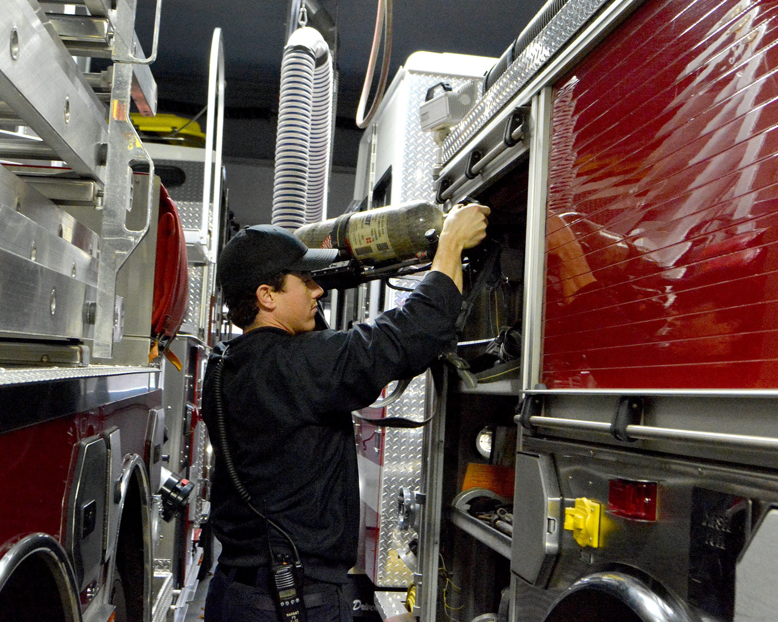 Nahant. Fire Station. Jon Tibbo, Nahant Fire Fighter goes through the daily check of Engine 31.