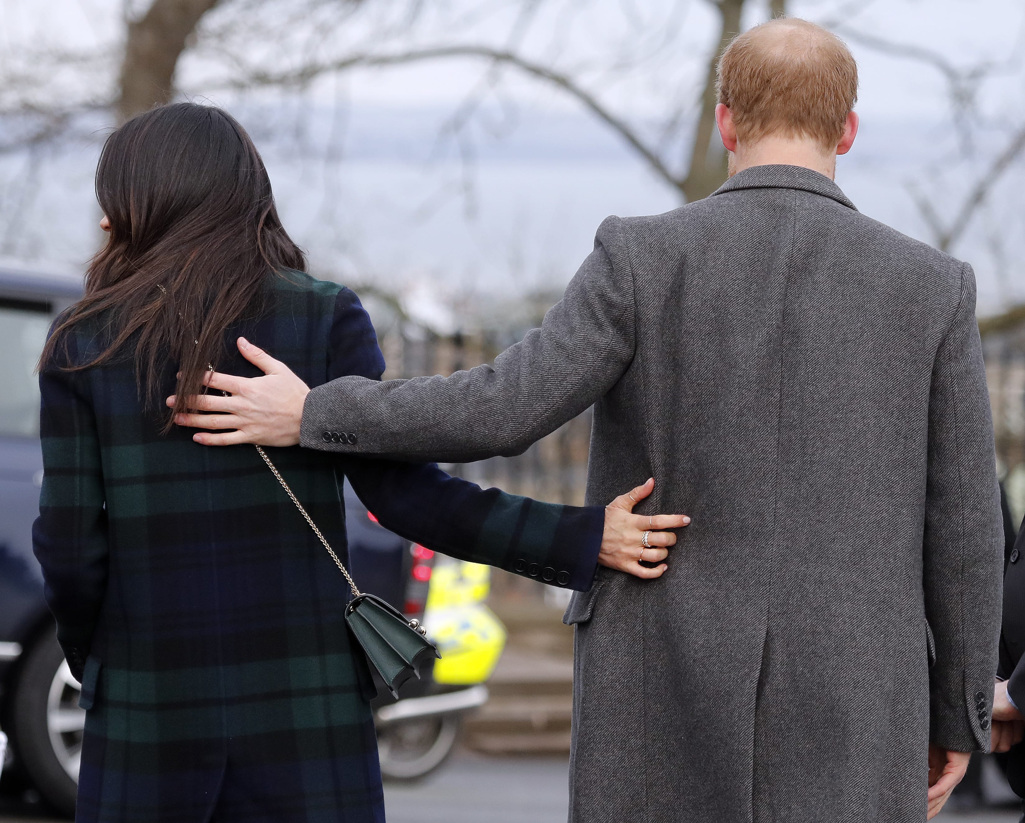 FILE - In this file photo dated Tuesday, Feb. 13, 2018, Britain's Prince Harry and his fiancee Meghan Markle arrive at Edinburgh Castle in Edinburgh, Scotland. Kensington Palace said Monday May 14, 2018, that Britain’s Prince Harry and Meghan Markle are requesting “understanding and respect” for Markle’s father after a celebrity news site reported he would not be coming to the royal wedding to walk his daughter down the aisle. (AP Photo/Frank Augstein, FILE)