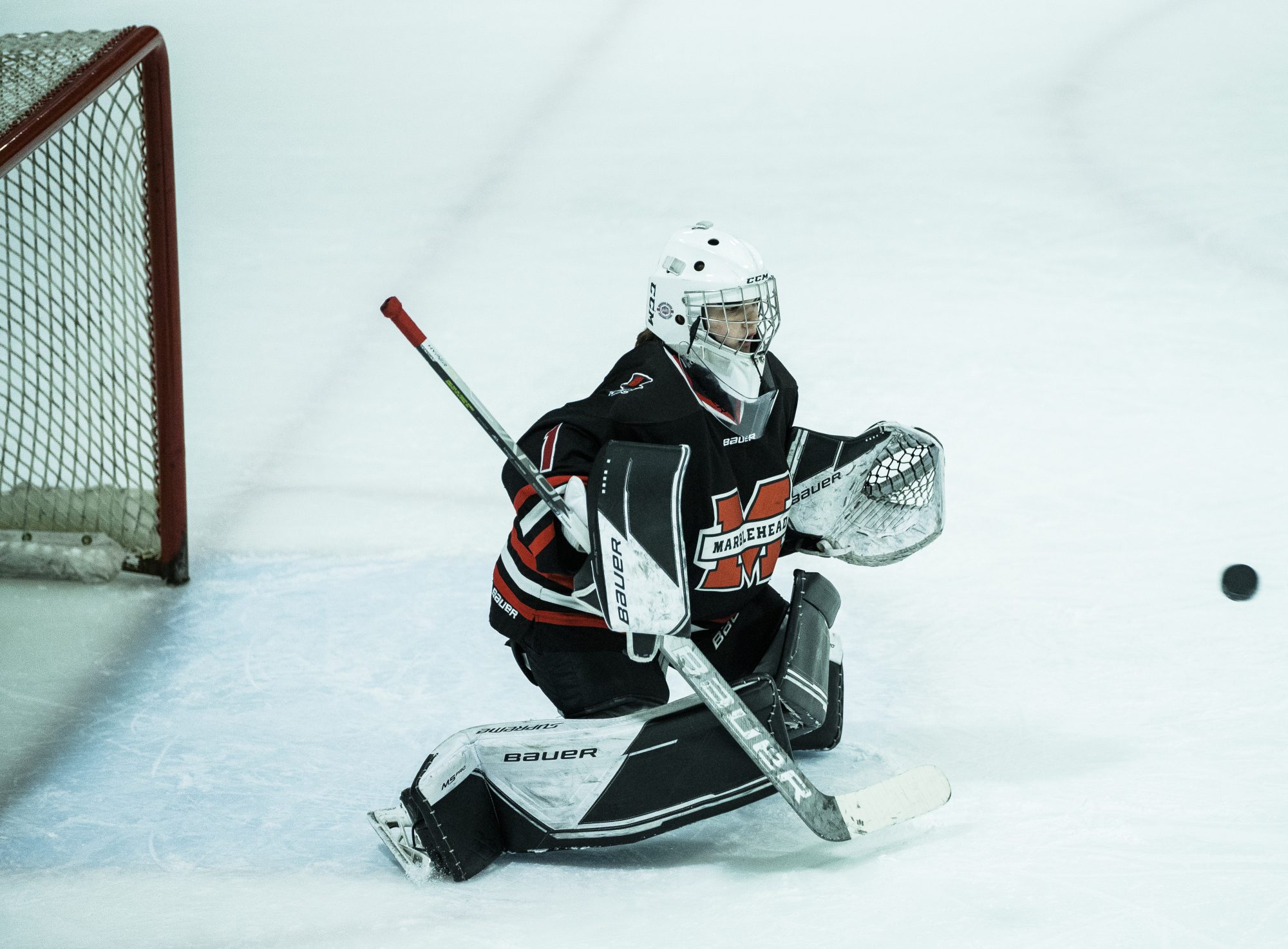 Marblehead goalie Liv Doucette makes a stop against Peabody/Lynnfield.