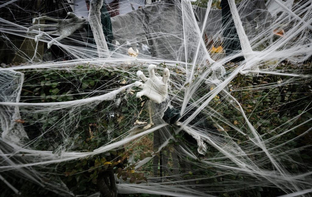 Haunted hands reach out from the bushes in front of 26 Broadway in Lynn.